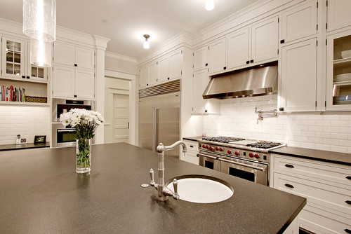 Black Granite Countertops White Cabinets Light Wood Floor Subway Tile Backsplash White Cabinetry Black Countertop